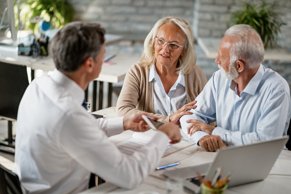 Older couple estate planning to protect their house title.