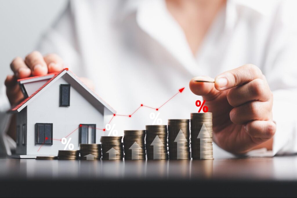 Business woman hand and stack coins money with up arrow and percentage symbol