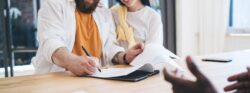 Couple signing mortgage documents