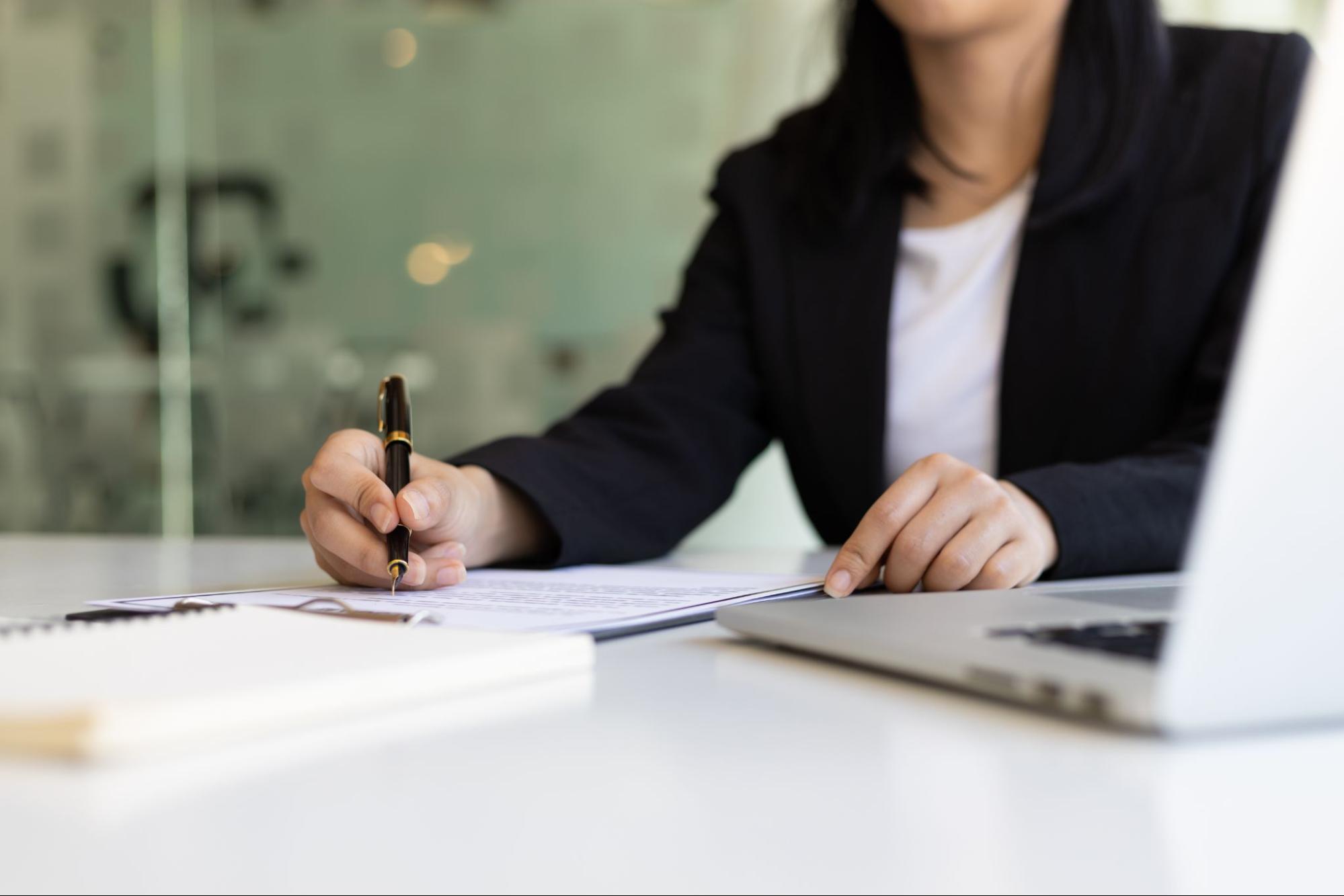 A real estate lawyer filling out paperwork. 
