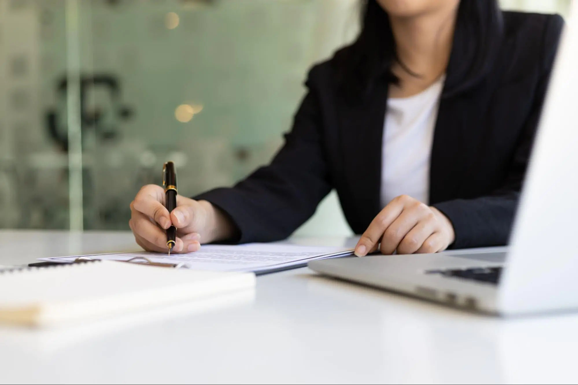 A real estate lawyer filling out paperwork.
